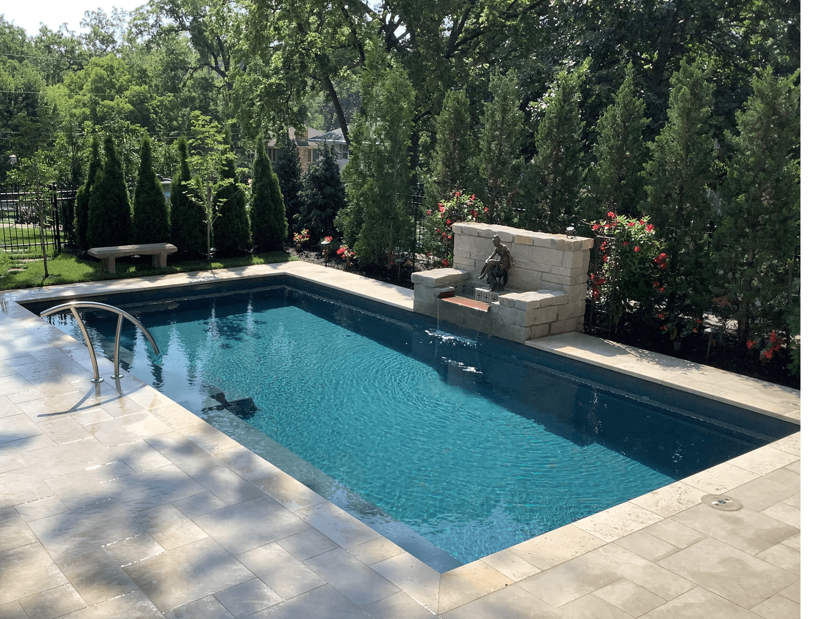 A luxury backyard pool and outdoor living space built by Jaeli Construction